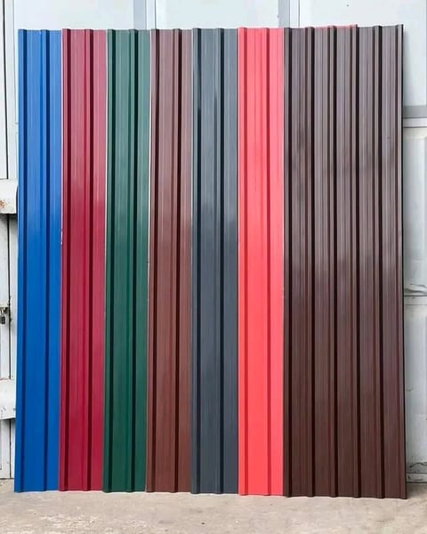 Display of vertical corrugated metal panels in various colors including blue, red, green, brown, gray, and pink